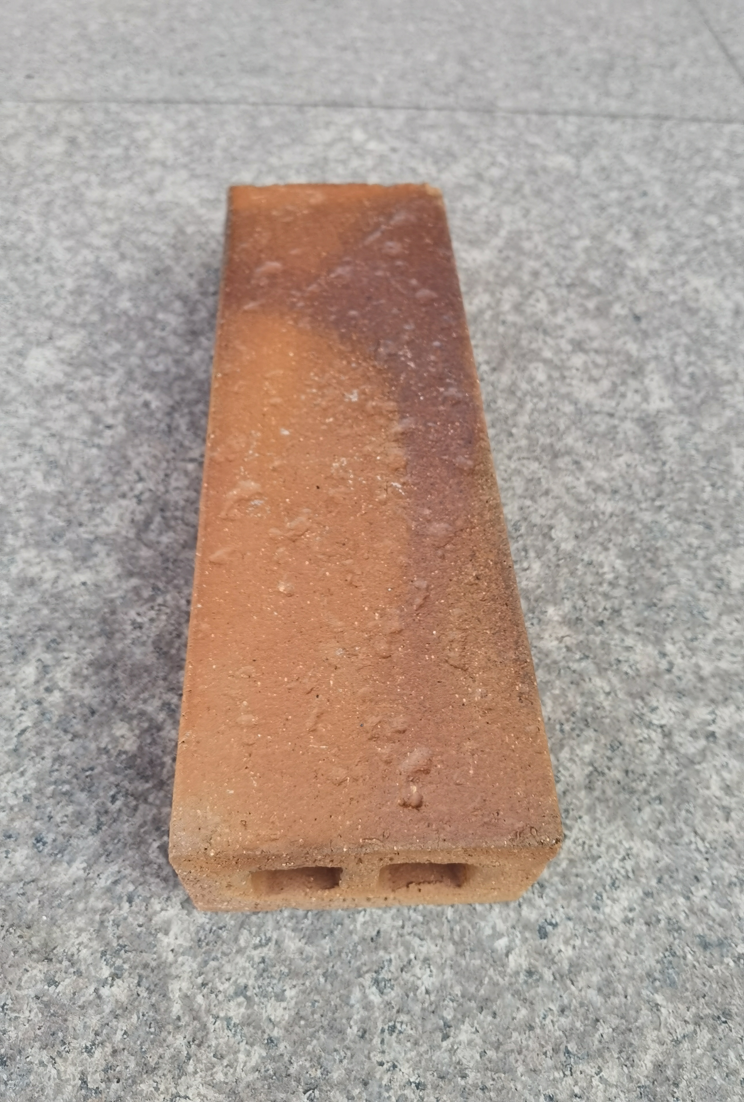 Terracotta wet-applied brick